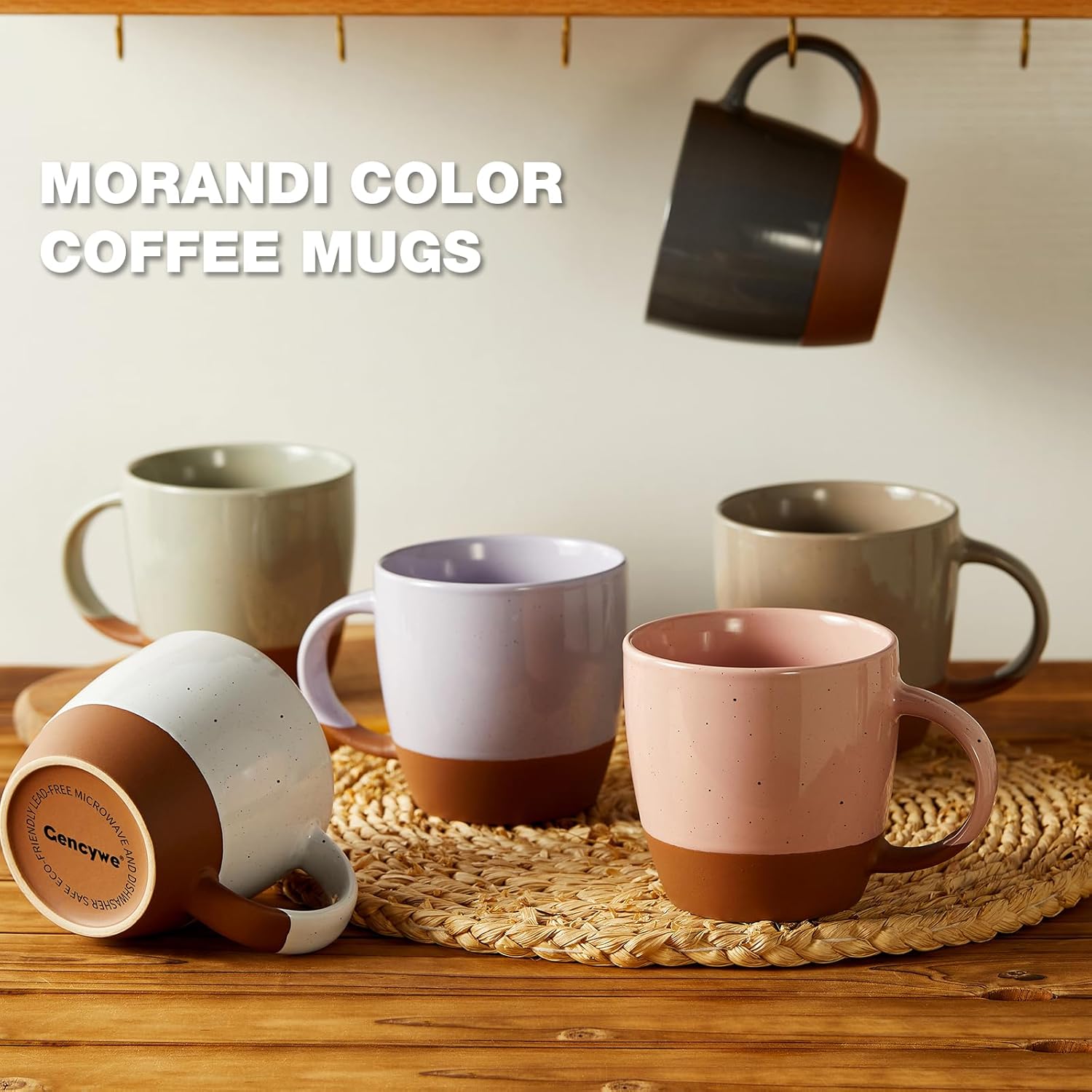 Set of neutral-toned ceramic coffee mugs in soft muted colors with a two-tone glaze